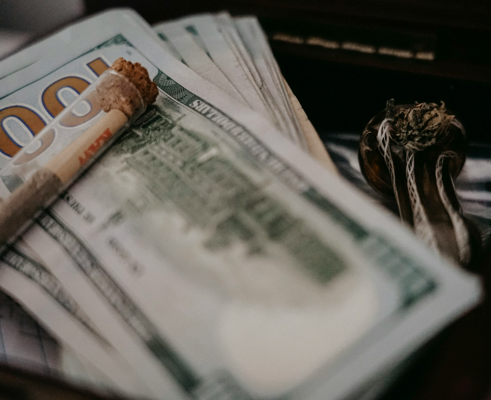 a pile of money sitting on top of a table